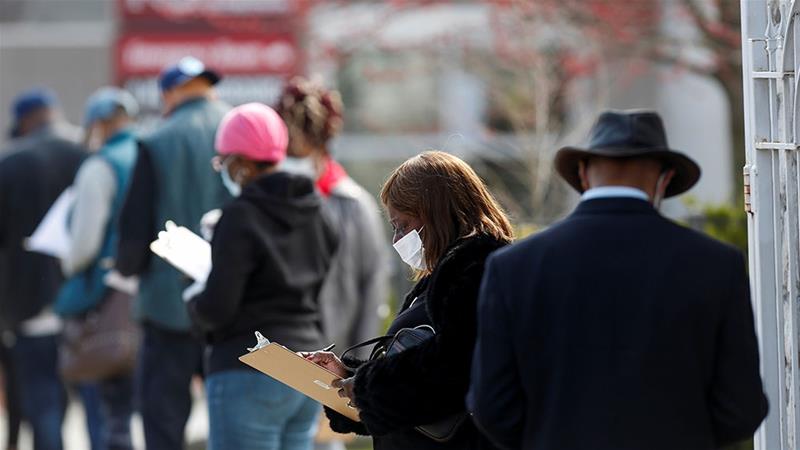 People wait in line to receive testing during the global outbreak of the coronavirus disease (COVID-19) outside Roseland Community Hospital in Chicago, Illinois [Joshua Lott/Reuters]