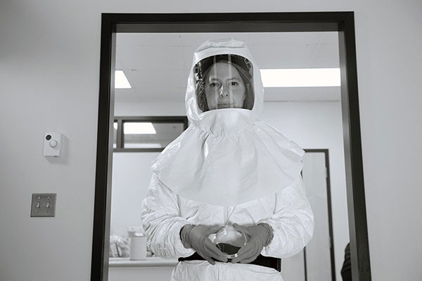 Alyson Kelvin pictured wearing protective clothing in her containment lab.